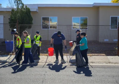 Team members cleaning up the community